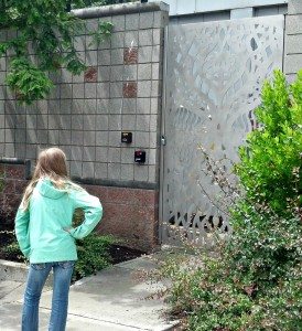 Logan admiring a metal-sculpted gate by local Cuba artist Juan Alonso