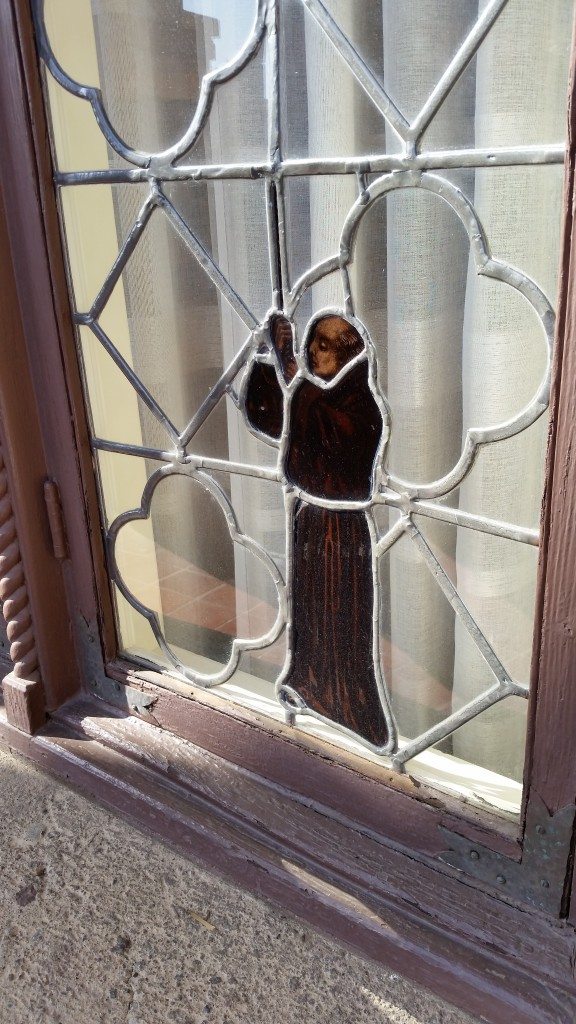 Stained glass monk detail on a window