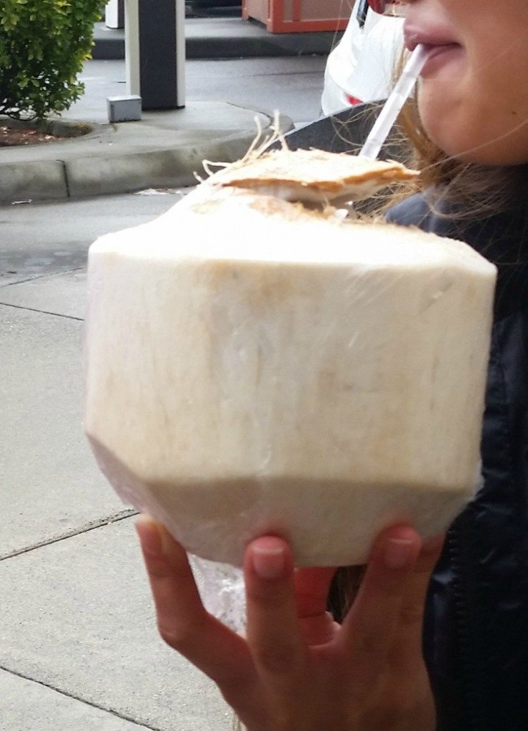 drinking a coconut